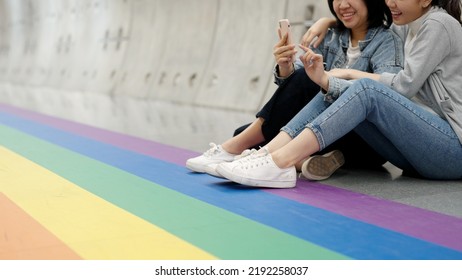 Young Adult Queer Lover Transgender Asia Two Gay People Fun Happy Enjoy Selfie Digital Photo Shoot At Colorful Floor. LGBT LGBTQIA Color Bisexual Family Festival Hug Love Smile At City Street Town.