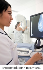 A Young Adult Radiologist Reviewing The Results Of Patient?s Mammogram On High Definition Monitor At A Radiology Clinic