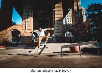 Young adult skating outdoors - Stylish skater boy training in a New York skate park, concepts about sport and ifestyle
