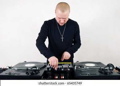 Young Adult White DJ Guy Playing Music On Analog Turntables. Vinyl Records For Disc Jockey. Studio Shot, White Background. Audio Equipment For Professional Night Club Party Set