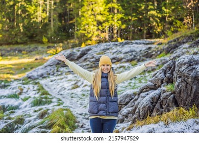 Young adult woman alone slowly walking after snowfall. Peaceful atmosphere in amazing awesome winter day. Enjoying fresh air in snowy forest trail