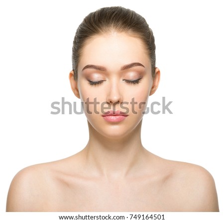 Young adult woman with beautiful face, clean healthy skin - isolated on white. Skin care concept. Closed eyes.