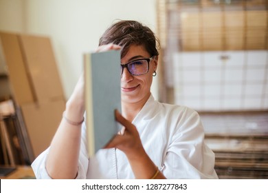 Young adult woman making a notebook in his laboratory