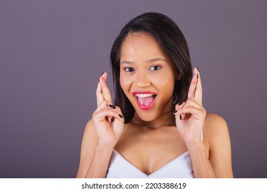 young adult woman from northeastern brazil. countenance, close-up photo sign of luck, cheering, wishing. - Shutterstock ID 2203388619