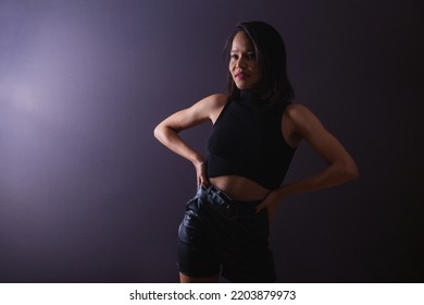 Young Adult Woman From Northeastern Brazil. Female Portrait, Against Light, Underexposed Photo. Low Light.