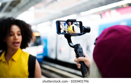 Young adult woman traveling and blogging social media concept - Shutterstock ID 1033401796