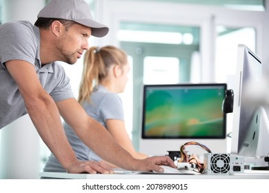 Young Adults Fixing Computer Hardware In Technology School