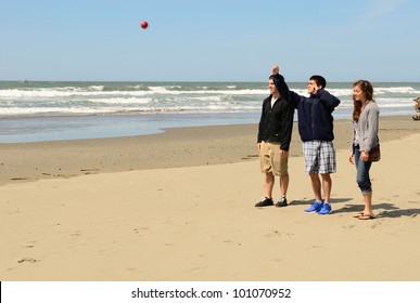 Young Adults Playing Bocce Ball On The Beach Near Bandon Oregon