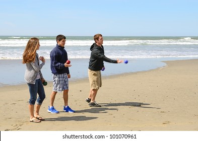 Young Adults Playing Bocce Ball On The Beach Near Bandon Oregon