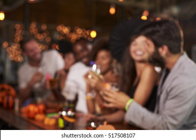 Young Adults Socialising At A Party In A Bar, Defocussed