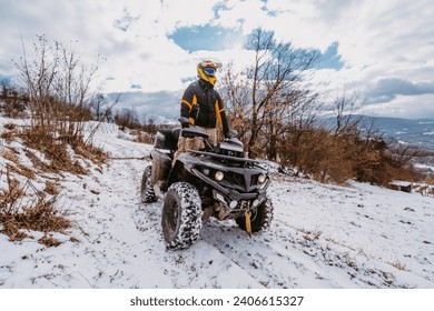 A young adventurous couple embraces the joy of love and thrill as they ride an ATV Quad through the snowy mountainous terrain - Powered by Shutterstock