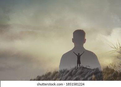 Young Adventurous Man On Top A Mountain Feeling Free, And Happy In Nature. Double Exposure 