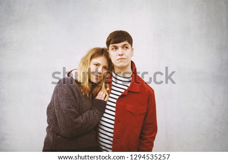 Similar – Image, Stock Photo young couple in love in front of a concrete wall with free space for text