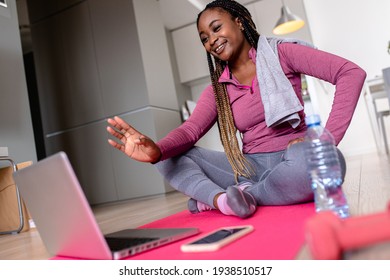 Young African America Woman At Home Doing Exercise.