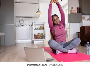 Young African America Woman At Home Doing Exercise.