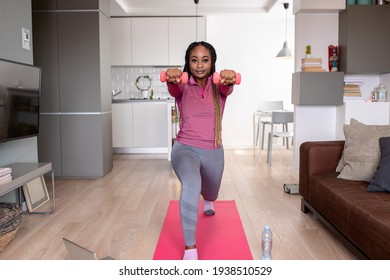 Young African America Woman At Home Doing Exercise.