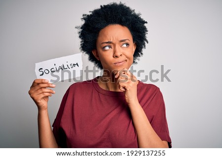 Young African American afro politician woman with curly hair socialist party member serious face thinking about question, very confused idea