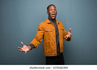 young african american black man performing opera or singing at a concert or show, feeling romantic, artistic and passionate against grunge wall
