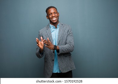 Young African American Black Man Feeling Happy And Successful, Smiling And Clapping Hands, Saying Congratulations With An Applause