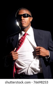 A Young African American Business Man Ripping His Shirt Open To Reveal The T-shirt Beneath. Add Your Text Or Artwork To Easily Customize The Message.