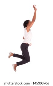 Young african american business woman jumping, success concept, isolated on white background