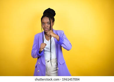 Young African American Business Woman Punching Fist To Fight, Aggressive And Angry Attack, Threat And Violence