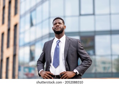 Young African American Businessman Posing By Office Center, Happy Male Entrepreneur Having Break And Walking Outdoors, Looking Away, Copy Space