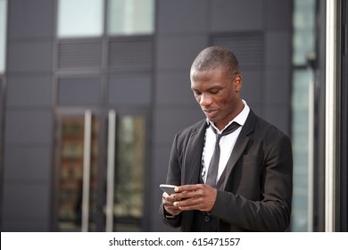 young african american businessman using smart phone - Shutterstock ID 615471557