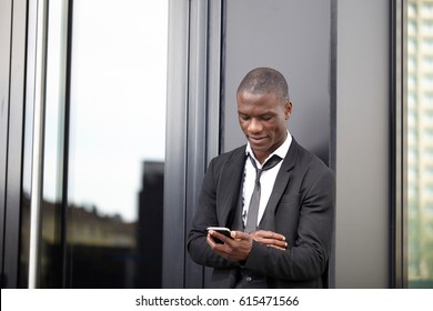 young african american businessman using smart phone - Shutterstock ID 615471566