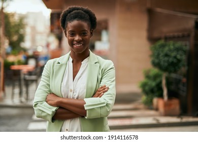 Young African American Businesswoman With Crossed Arms Smiling Happy At The City