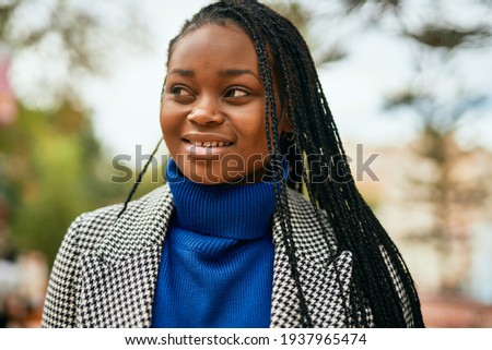 Young african american businesswoman smiling happy standing at the park.
