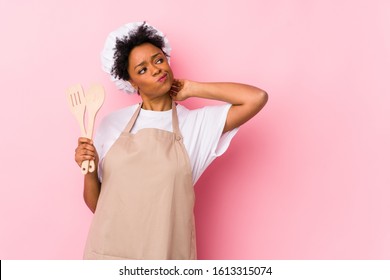 Young african american cook woman touching back of head, thinking and making a choice. - Powered by Shutterstock