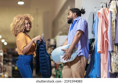 Young African American Couple Buying Clothes 