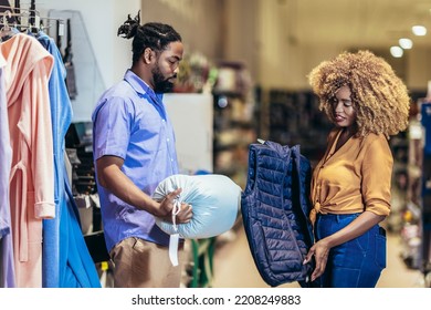 Young African American Couple Buying Clothes 