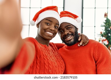 Young african american couple smiling happy make selfie by the camera at home. - Powered by Shutterstock