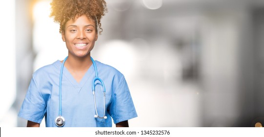 Young african american doctor woman over isolated background Hands together and fingers crossed smiling relaxed and cheerful. Success and optimistic