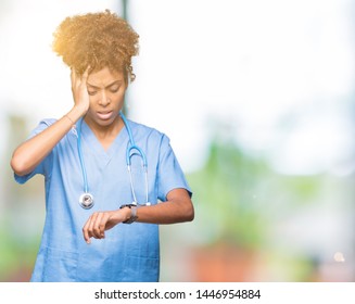 Young African American Doctor Woman Over Isolated Background Looking At The Watch Time Worried, Afraid Of Getting Late