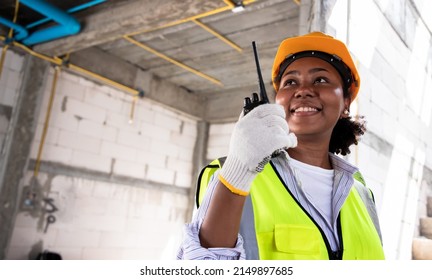 Young African American Engineer And Architect Working At Construction Site With Calculate Spending Report Inside House. Real Estate Project With Civil Engineer. Power Line Inspection