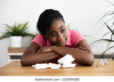 Young African American exchange student woman sitting at home after her bad experience with racists. African college teenage girl victim of racism crying from anger and fear. - Powered by Shutterstock