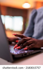 Young African American Female Freelancer Typing On Laptop Keyboard, Close View On Hands. Businesswoman Browsing Internet, Writing Email On Computer, Focus On Manicured Nails