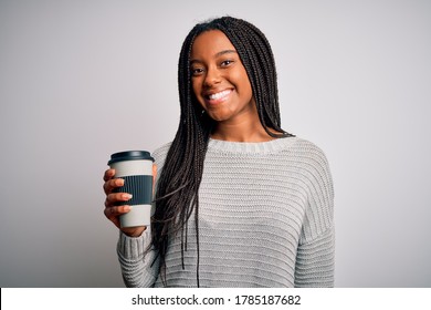 Young african american girl drinking coffe on a take away plastic cup over isolated background with a happy face standing and smiling with a confident smile showing teeth