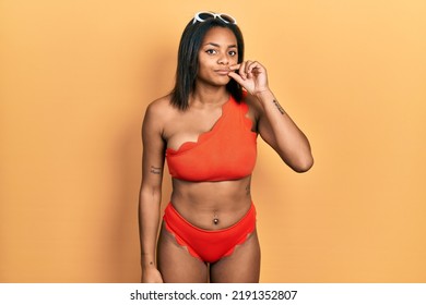 Young African American Girl Wearing Bikini Mouth And Lips Shut As Zip With Fingers. Secret And Silent, Taboo Talking 