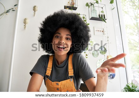 Similar – Image, Stock Photo Black woman, afro hairstyle, on roller skates riding outdoors on urban bridge with open arms.