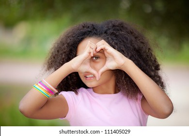 Young African American Kid Making Heart Shape With Hands