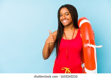 Young African American Life Guard Woman Isolated Smiling And Raising Thumb Up