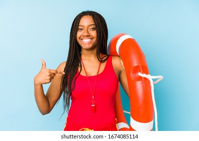 Young African American Life Guard Woman Isolated Person Pointing By Hand To A Shirt Copy Space, Proud And Confident