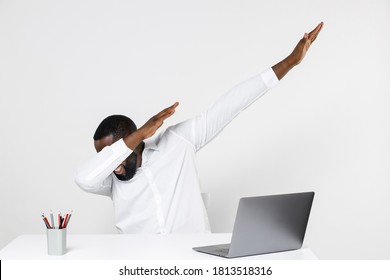 Young African American Male Business Man In Classic Shirt Work In Office Sit At Desk With Laptop Doing Dab Dance Gesture Hip Hop Hands Youth Sign Cover Hiding Cover Face Isolated On White Background