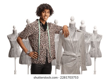 Young african american male fashion designer leaning on a doll mannequin with a dress isolated on white background - Powered by Shutterstock