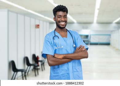 Young African American Male Nurse With Beard At Vaccination Station Is Ready For Vacinating Patients Against Coronavirus Infection