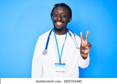 Young african american man with braids wearing doctor stethoscope and id pass smiling with happy face winking at the camera doing victory sign. number two. 